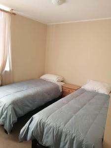Cama ou camas em um quarto em Departamento de 3 habitaciones frente a la universidad de Talca