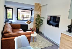 TV a/nebo společenská místnost v ubytování Plasencia Plaza Mayor Luxury