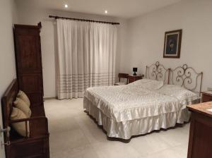 Ένα ή περισσότερα κρεβάτια σε δωμάτιο στο Casa Jacopo deliziosa villa con giardino