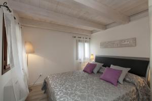 A bed or beds in a room at Residenza Tiziano