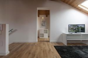 A television and/or entertainment centre at Residenza Tiziano