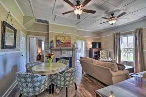 a living room with a couch and a table at Cozy Currituck Home with Fire Pit near Ferry! in Currituck