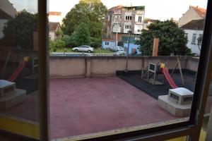 a view of a playground from a window at Apartamento centro Villagarcía. in Vilagarcia de Arousa