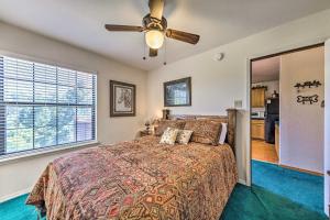a bedroom with a bed and a ceiling fan at Charming Alto Hideaway Less Than 14 Mi to Ski Apache! in Alto +21 photos