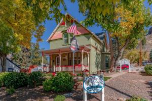 a house with an american flag on top of it at The Silk Pincushion in Golden