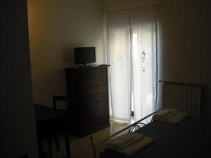 TV a/nebo společenská místnost v ubytování Residenza Sulla Roccia