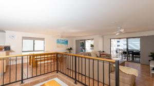 a living room with a balcony with a couch at Breakers Block 5 Unit 6 in Yamba