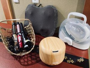 a basket of items on a counter next to a bag at Kyoto Inn Gion The Second in Kyoto