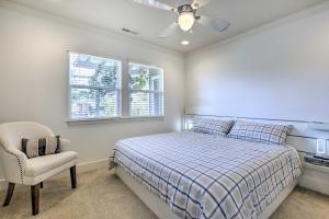 a bedroom with a bed and a chair and a window at Peaceful Petaluma Getaway with Deck and Grill! in Petaluma