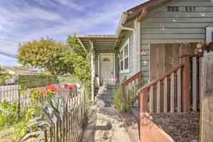 a house with a wooden fence in front of it at Peaceful Petaluma Getaway with Deck and Grill! in Petaluma