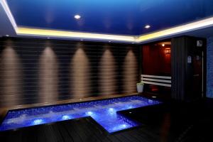 a swimming pool with blue lights in a room at Best Western Plus Paradise Hotel Dilijan in Dilijan +222 photos