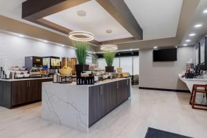 a lobby with a counter and aasteryasteryasteryasteryasteryasteryasteryasteryastery at Best Western Corpus Christi Airport Hotel in Corpus Christi