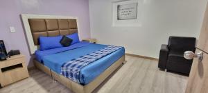 Postel nebo postele na pokoji v ubytování Blue House Corferias