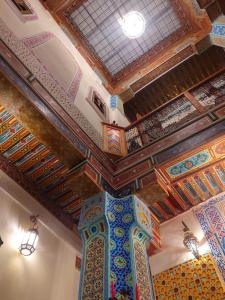 a room with a ceiling with colorful tiles on it at Palais Fes Yahya in Fès al Bali