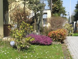 A garden outside New Inn Residence