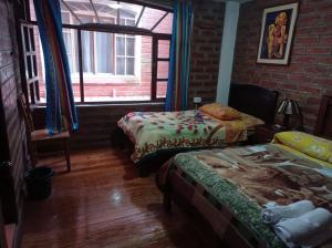 Ένα ή περισσότερα κρεβάτια σε δωμάτιο στο Hostal D´Mathias