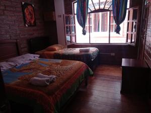 Ένα ή περισσότερα κρεβάτια σε δωμάτιο στο Hostal D´Mathias