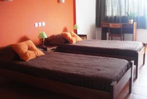 Ein Bett oder Betten in einem Zimmer der Unterkunft HI Almograve – Pousada de Juventude