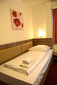 מיטה או מיטות בחדר ב-ITM Hotel Motel21 Hamburg-Mitte