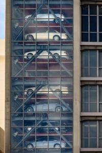 a building with a bunch of cars on the side of it at The Granite Luxury Hotel Penang in George Town