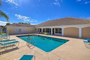 a swimming pool in the backyard of a house at The Shell House with Pool and Golf Access! in Titusville