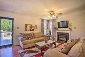 a living room with a couch and a fireplace at Charming Sandston Home about 9 Mi to Richmond! in Sandston