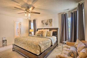 a bedroom with a bed and a ceiling fan at Charming Sandston Home about 9 Mi to Richmond! in Sandston