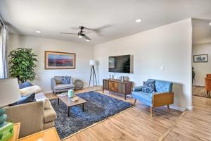 a living room with a couch and chairs and a table at Sunny Phoenix Home with Pool and Backyard Oasis! in Phoenix