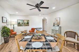 a dining room and living room with a table and chairs at Sunny Phoenix Home with Pool and Backyard Oasis! in Phoenix
