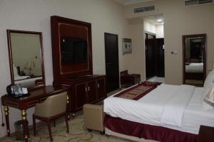 Al Salam Grand Hotel客房内的一张或多张床位