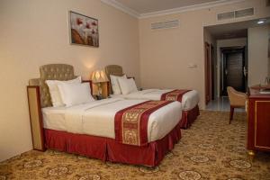 Al Salam Grand Hotel客房内的一张或多张床位