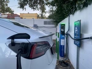 a car is hooked up to a hydrogen fueling station at Greif Hotel Maria Theresia in Trieste