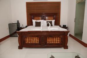 Postel nebo postele na pokoji v ubytování Lawrence View Hotel, Lahore