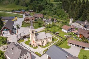 an aerial view of a small village with a church at Ferienwohnung Seifterhof in Sankt Andrä im Lungau