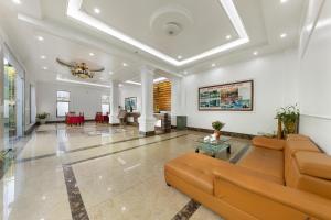 a large living room with a couch and a table at Airport Transit Hotel in Hanoi