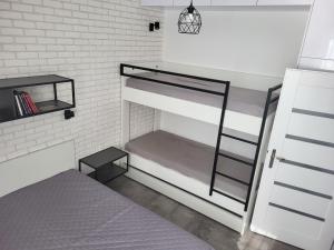 A bed or beds in a room at Apartmán Pekná Vyhliadka - Vila Vlasta