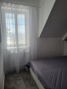 A bed or beds in a room at Apartmán Pekná Vyhliadka - Vila Vlasta