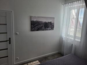 A bed or beds in a room at Apartmán Pekná Vyhliadka - Vila Vlasta
