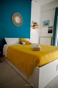 Giường trong phòng chung tại Casa Vacanza Le Dune - Mare