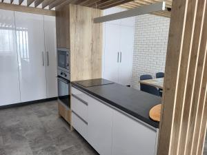 A kitchen or kitchenette at Apartmán Pekná Vyhliadka - Vila Vlasta