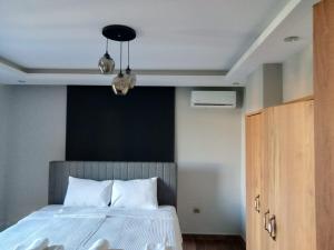 Ένα ή περισσότερα κρεβάτια σε δωμάτιο στο Villa Emre 13 +31 φωτογραφίες