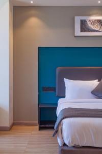 Postel nebo postele na pokoji v ubytování REPUBLIC INN