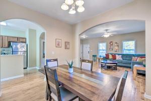 a dining room and living room with a wooden table at Lovely East Point Home Less Than 8 Mi to Downtown ATL in Atlanta