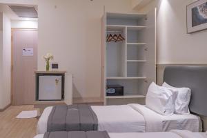 Postel nebo postele na pokoji v ubytování REPUBLIC INN