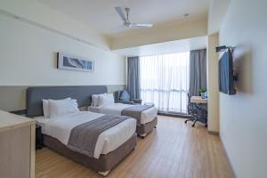 Postel nebo postele na pokoji v ubytování REPUBLIC INN
