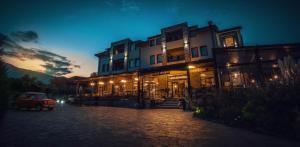 a building with a car parked in front of it at Ciflik Winery in Bitola