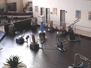 a gym with a bunch of chairs and a stage at Pension Einsiedelei in Zwiesel