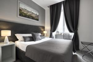 A bed or beds in a room at Rhome Guest House