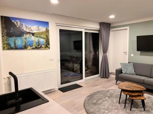 TV a/nebo společenská místnost v ubytování Haus Tilia Karinthië Appartementen