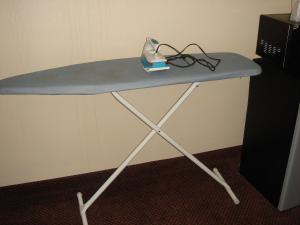 a table with a iron on top of it at German Village Inn Motel in Columbus +13 photos